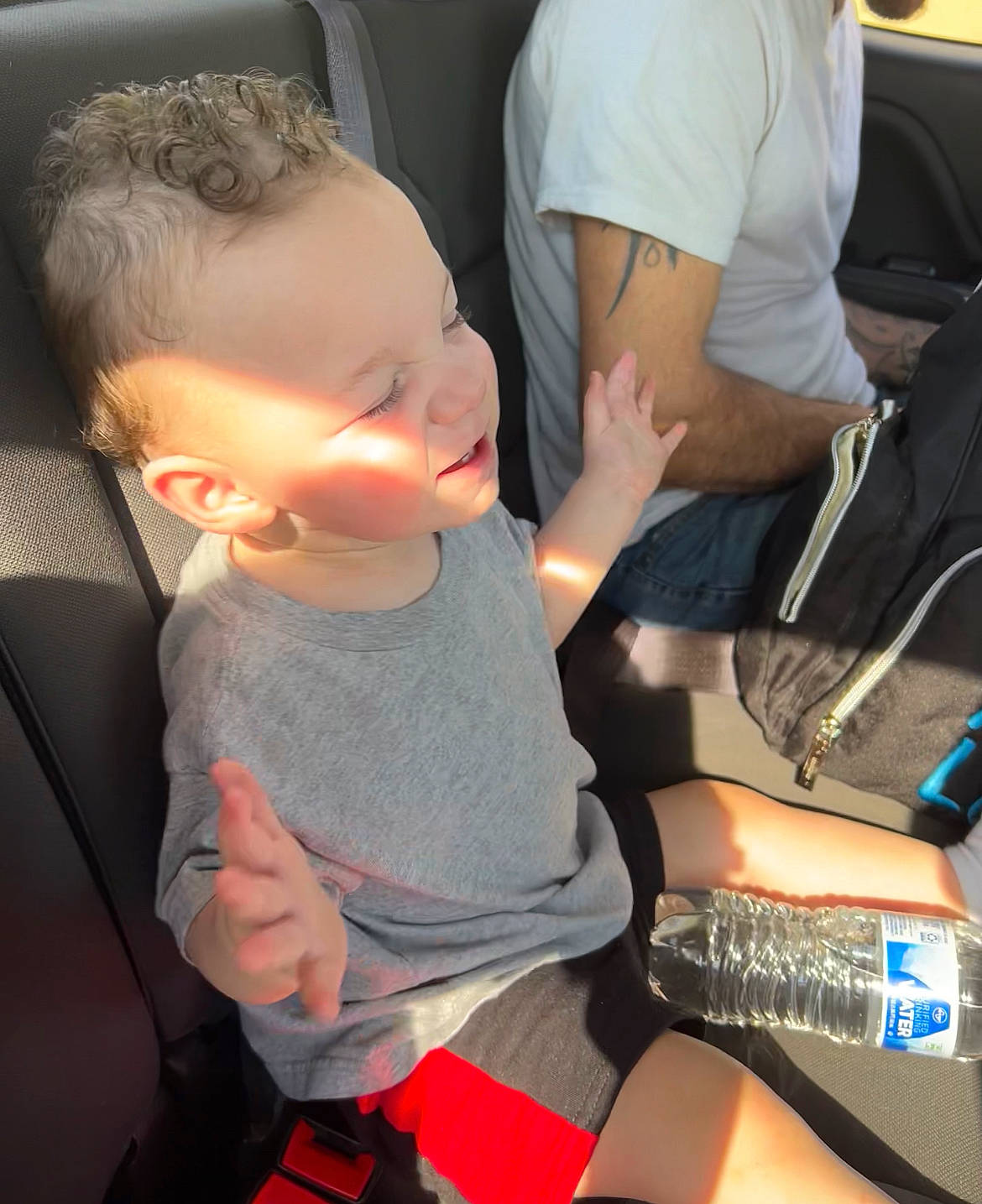 Amir joined the competition — help win amazing prizes! baby, car_seat, child, eyewear, finger, fun, gesture, hand, human_leg, joint, lap, nail, person, shoulder, sitting, t_shirt, thigh, thumb, toddler, vehicle_door