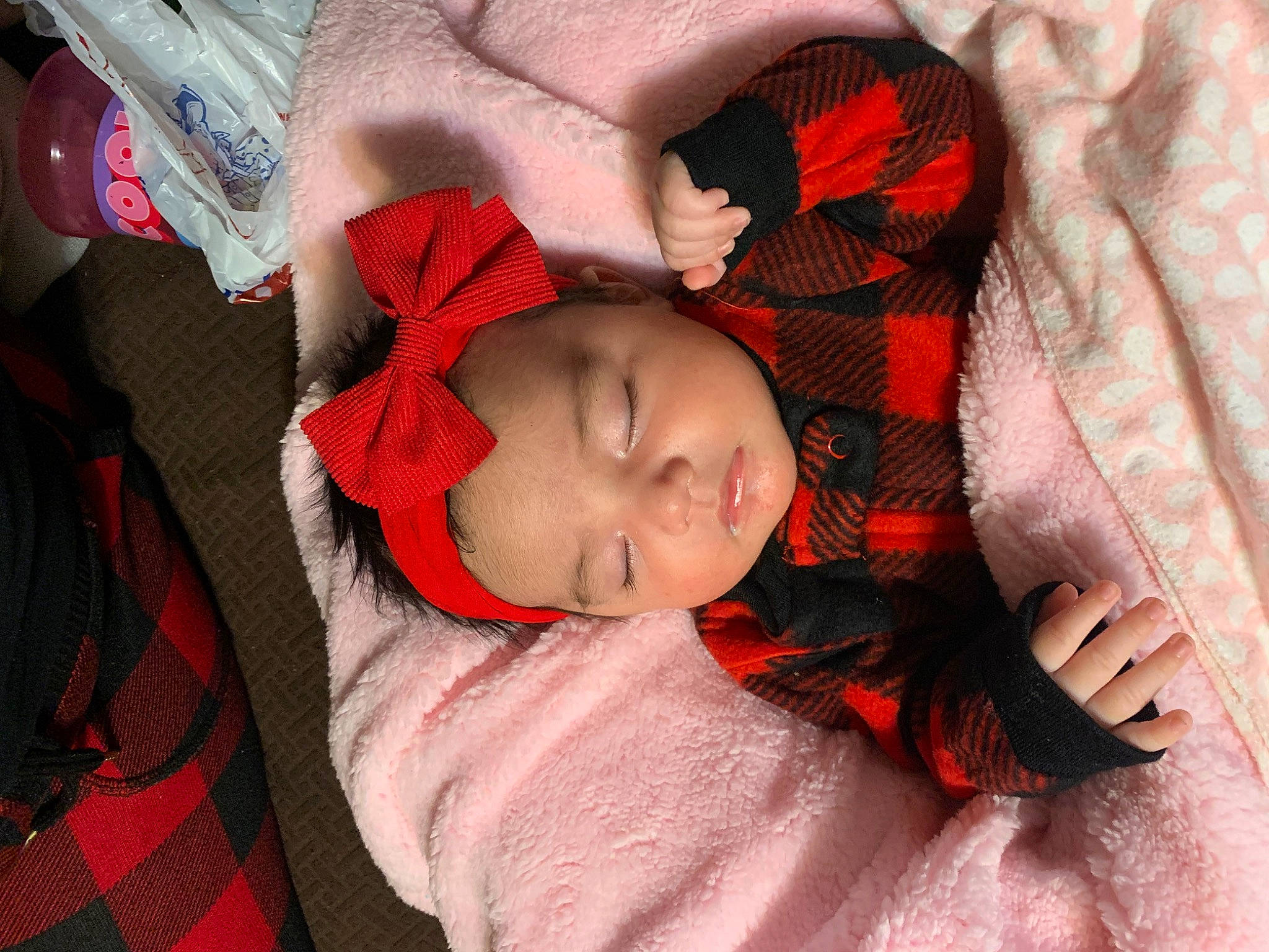 Dalia is registered to the contest to win money with this photo: baby, baby_toddler_clothing, bedtime, carmine, cheek, child, comfort, eyelash, finger, flesh, headwear, linens, orange, pattern, person, plaid, sleeve, tartan, textile, thumb