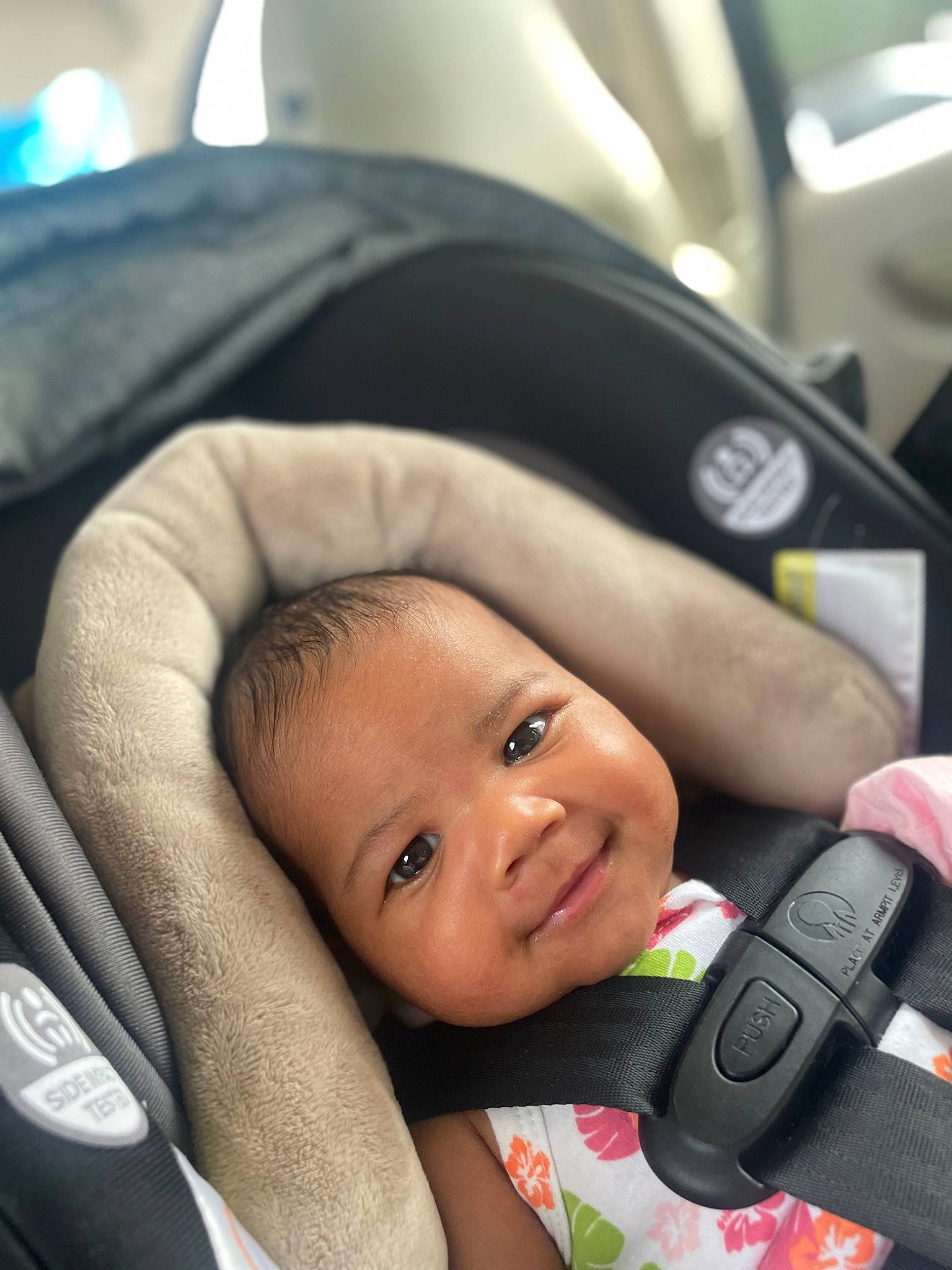 Charlie is registered to the contest to win money with this photo: auto_part, baby, baby_carriage, baby_products, baby_safety, baby_toddler_clothing, car_seat, cheek, child, comfort, face, finger, happy, joy, nail, person, product, seat_belt, skin, smile
