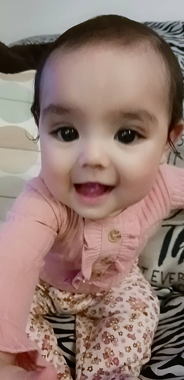 Azariah is registered to the contest to win money with this photo: baby, baby_toddler_clothing, cheek, chin, dress, eye, eyebrow, eyelash, facial_expression, forehead, hairstyle, happy, head, lip, mouth, nose, person, skin, sleeve, smile