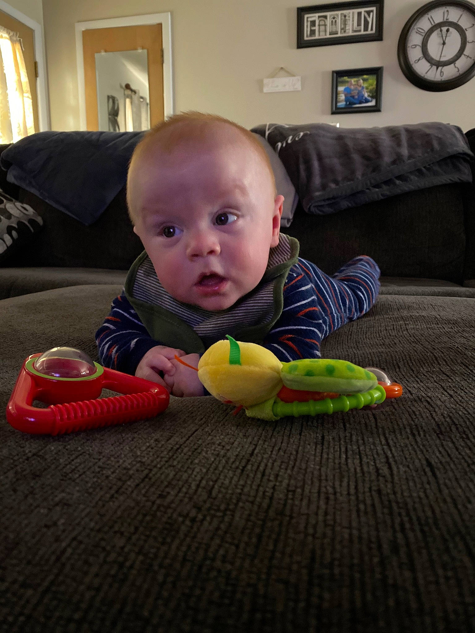 Kaden is registered to the contest to win money with this photo: baby, baby_toys, cheek, child, crawling, eye, face, floor, flooring, fun, head, nose, person, play, room, sitting, skin, smile, surprise, toddler