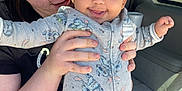 Emriella joined the competition — help win amazing prizes! baby, woman, child, car_interior, onesie, tattoo, smiling, holding, sunlight, cute, stitch_pattern, portrait, happy, person, indoor, seat, clothing, face, hand, toddler