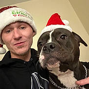 Nala joined the competition — help win amazing prizes! human, dog, santa_hat, holiday, christmas, indoor, portrait, black_hoodie, chain_collar, pet, smile, face, head, animal, friendship, festive, cute, companion, celebration, winter