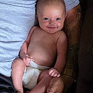 Cienna joined the competition — help win amazing prizes! baby, infant, child, smiling, portrait, diaper, sitting, held, adult, arms, hands, family, indoor, close_up, happy, bare_chested, couch, clothing, skin, photography