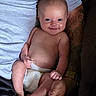 baby, infant, child, smiling, portrait, diaper, sitting, held, adult, arms, hands, family, indoor, close_up, happy, bare_chested, couch, clothing, skin, photography