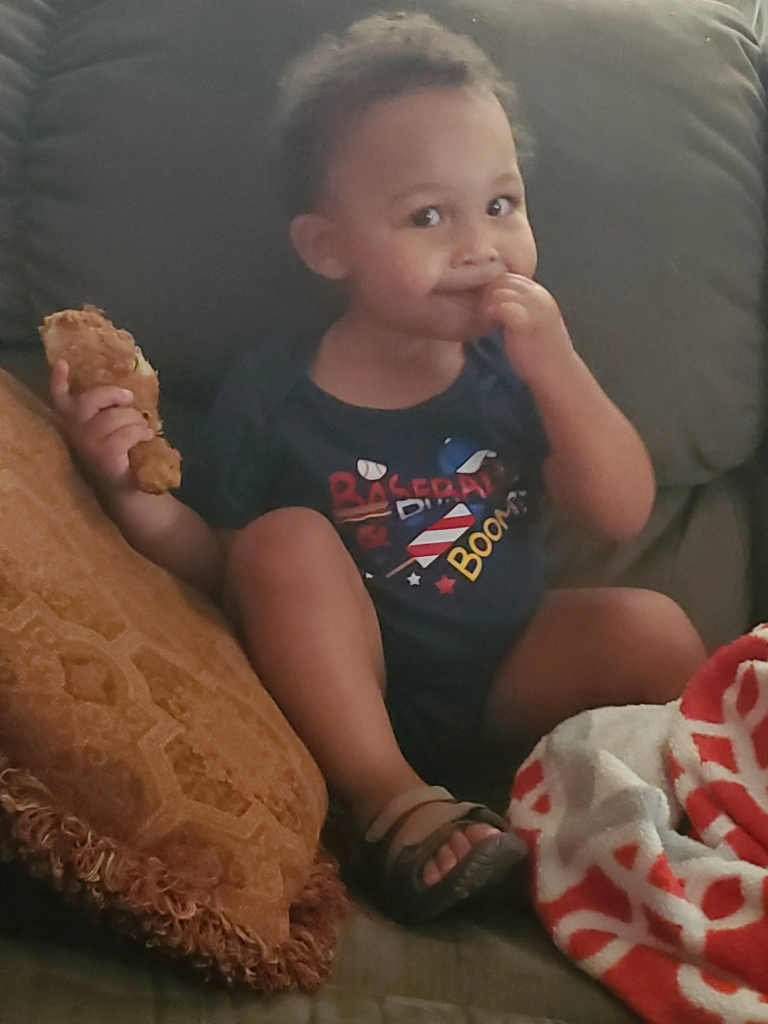 Tylan is registered to the contest to win money with this photo: arm, baby, barefoot, cheek, child, comfort, eye, finger, furniture, head, leg, person, play, sitting, skin, toddler