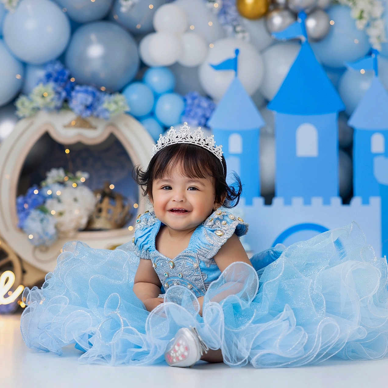 Julia Adrianna joined the competition — help win amazing prizes! baby, balloons, birthday, blue_dress, castle, celebration, child, cute, decorations, dress, fairy_lights, festive, floor, happy, indoor, one_year_old, portrait, smile, tiara, young_child
