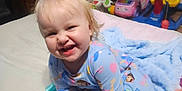 Willow joined the competition — help win amazing prizes! baby, bed, blanket, carrot_toy, child, colorful, cute, face, furniture, hair, happy, indoor, pajamas, person, play, room, smile, soft_toy, toddler, toy