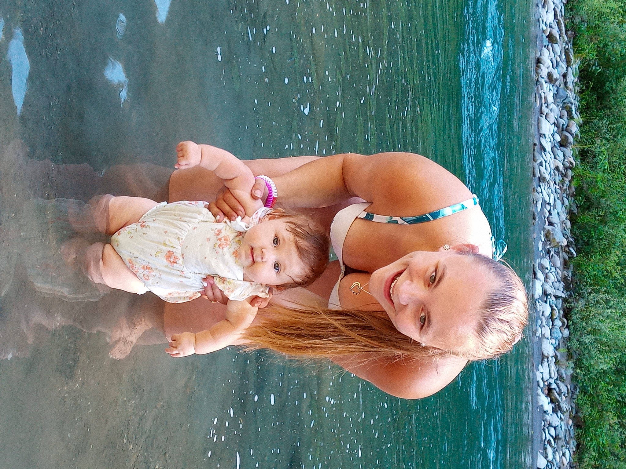 Miah joined the competition — help win amazing prizes! arm, body_of_water, dress, facial_expression, flash_photography, fun, grass, hand, happy, head, human_body, joy, lake, people_in_nature, person, plant, skin, smile, sunlight, toddler