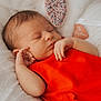 Victoria a rejoint le concours — aidez-le/la à gagner de superbes lots ! baby, newborn, sleeping, red_clothing, blanket, soft_texture, peaceful, infant, closeup, hand, face, resting, indoors, cute, portrait, child, skin, head, cozy, toddler