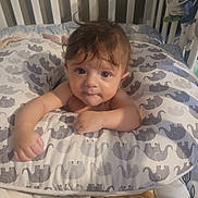 Anthony joined the competition — help win amazing prizes! baby, infant, pillow, elephant_pattern, crib, child, cushion, face, hair, looking, indoor, soft_furniture, cute, young_child, skin, hand, portrait, baby_bedding, resting, expression