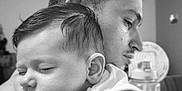 Aaron participe au concours pour gagner de l'argent avec cette photo : baby, black_and_white, calm, closeup, face, family, gentle, hair, indoor, intimate, love, man, peaceful, person, portrait, rest, shoulder, skin, sleeping, tattoo