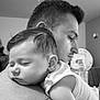baby, black_and_white, calm, closeup, face, family, gentle, hair, indoor, intimate, love, man, peaceful, person, portrait, rest, shoulder, skin, sleeping, tattoo