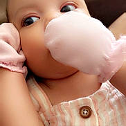 Jazariyah is registered to the contest to win money with this photo: baby, infant, mittens, clothing, striped, buttoned, face, eyes, cute, child, portrait, closeup, skin, hand, pink, soft, cozy, indoors, person, newborn