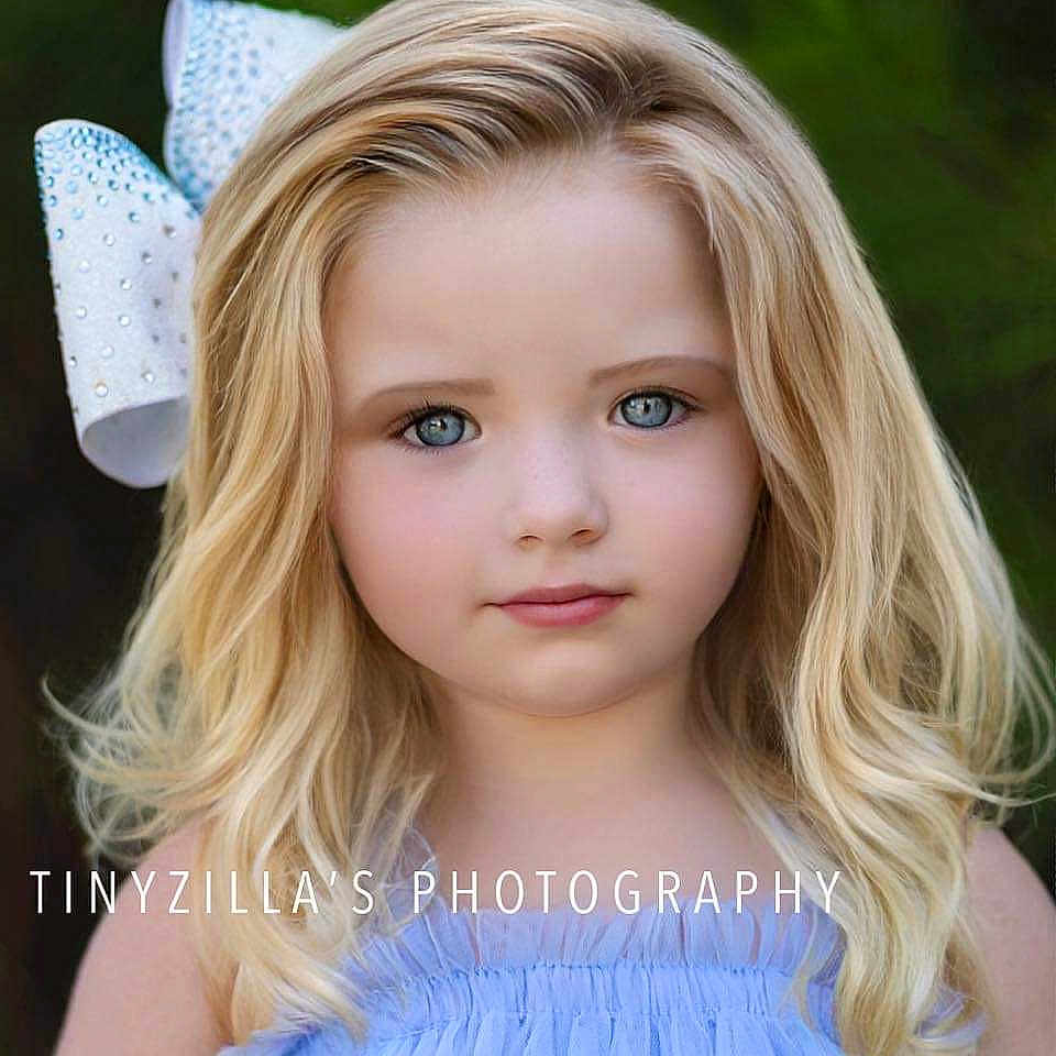 Oaklynn is registered to the contest to win money with this photo: blonde, child, clothing, costume, doll, dress, face, fashion, female, formalwear, girl, hair, haircut, hairdresser, hat, head, person, photography, portrait, toy