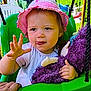 Lola a rejoint le concours — aidez-le/la à gagner de superbes lots ! toddler, child, swing, hat, pink, purple, stuffed_toy, outdoor, play, green, summer, sunhat, toy, baby, face, hand, expression, garden, cute, person