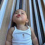Cecilia joined the competition — help win amazing prizes! baby, child, infant, pouting, white_tank_top, striped_hammock, cute, expression, outdoor, summer, skin, face, arms, casual_clothing, relaxing, funny_face, portrait, one_person, childhood, leisure