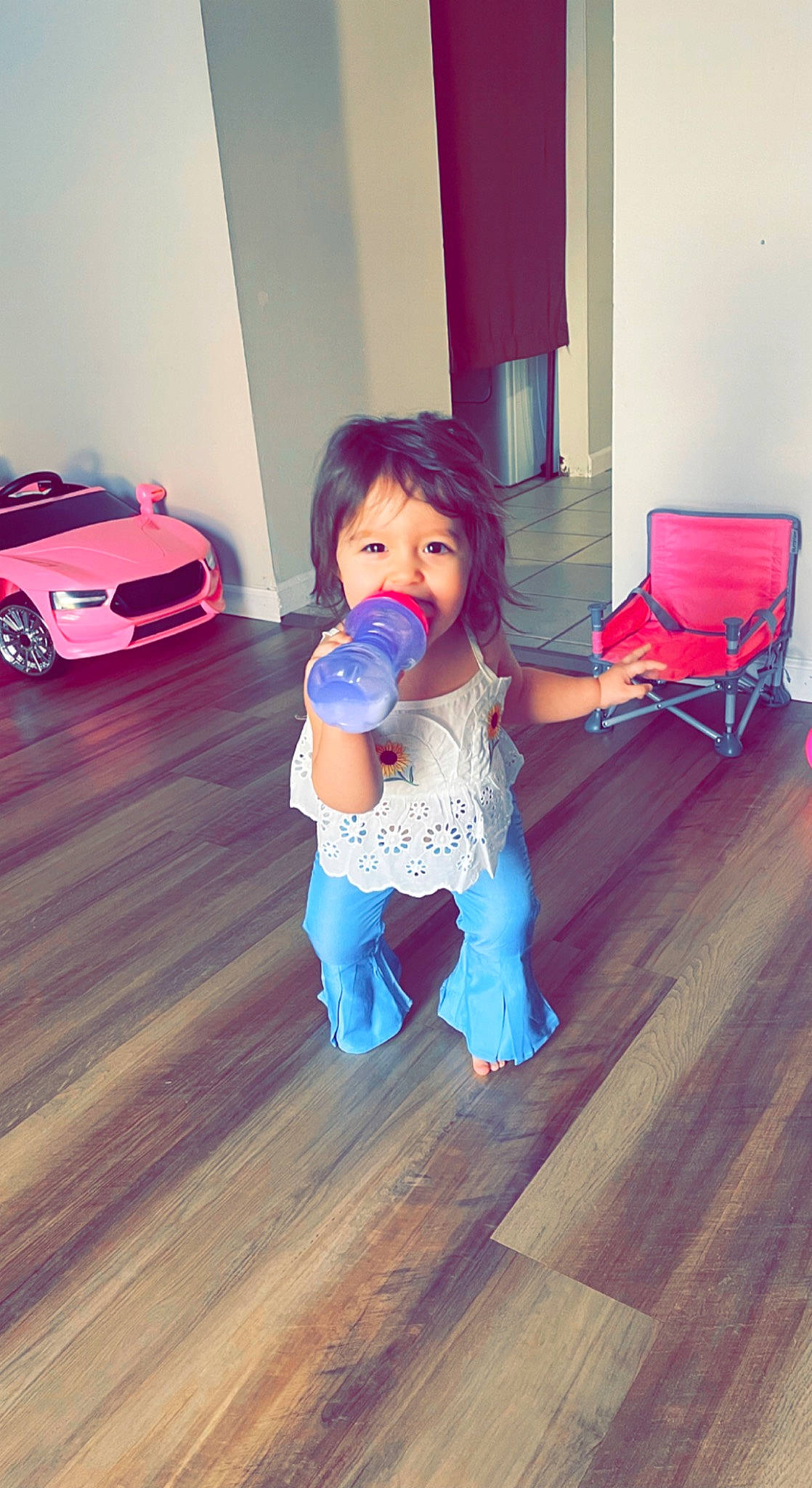 Anastacia Elizabeth is registered to the contest to win money with this photo: automotive_exterior, automotive_lighting, automotive_tire, bumper, curtain, floor, flooring, fun, happy, hardwood, hood, person, personal_luxury_car, shoulder, standing, tire, toddler, varnish, vehicle_door, wheel