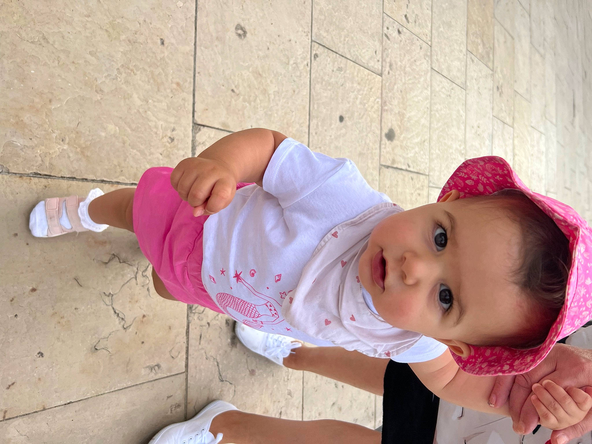 Lois participe au concours pour gagner de l'argent avec cette photo : baby, baby_toddler_clothing, child, dress, eye, face, facial_expression, happy, hat, head, human_leg, lip, nose, person, pink, plant, skin, sleeve, smile, toddler