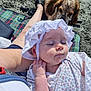 Olive joined the competition — help win amazing prizes! baby, infant, child, dog, pet, beach, sand, blanket, hat, bonnet, person, relaxing, nap, summer, outdoor, animal, cute, sleeping, portrait, hand