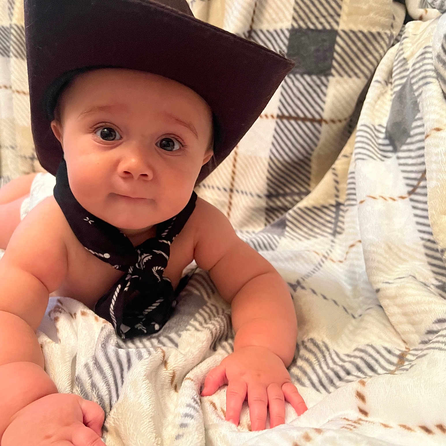 Ryan joined the competition — help win amazing prizes! baby, baseballcap, bed, bedroom, blanket, bonnet, cap, clothing, cowboyhat, face, furniture, hat, head, indoors, person, photography, portrait, quilt, room, sunhat