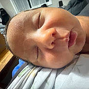 Ryker joined the competition — help win amazing prizes! baby, infant, sleeping, sleepy, portrait, close_up, face, eyes_closed, pout, peaceful, indoors, home, clothing, blanket, cuddled, resting, soft_lighting, candid, newborn, cozy