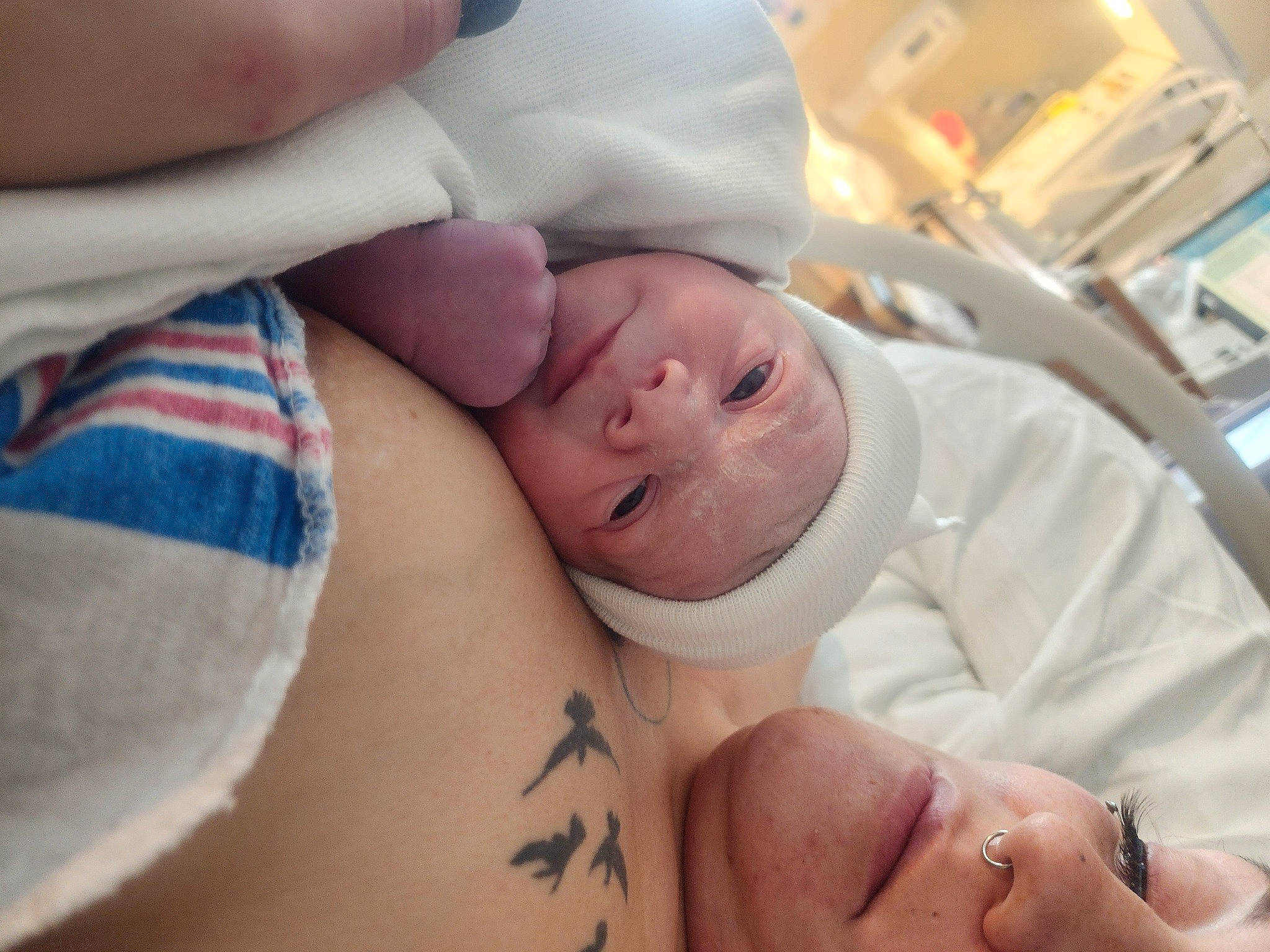 Ryker is registered to the contest to win money with this photo: abdomen, baby, baby_safety, baby_sleeping, baby_toddler_clothing, child, childbirth, comfort, event, finger, hand, hospital, linens, medical, mouth, person, room, service, skin, thumb