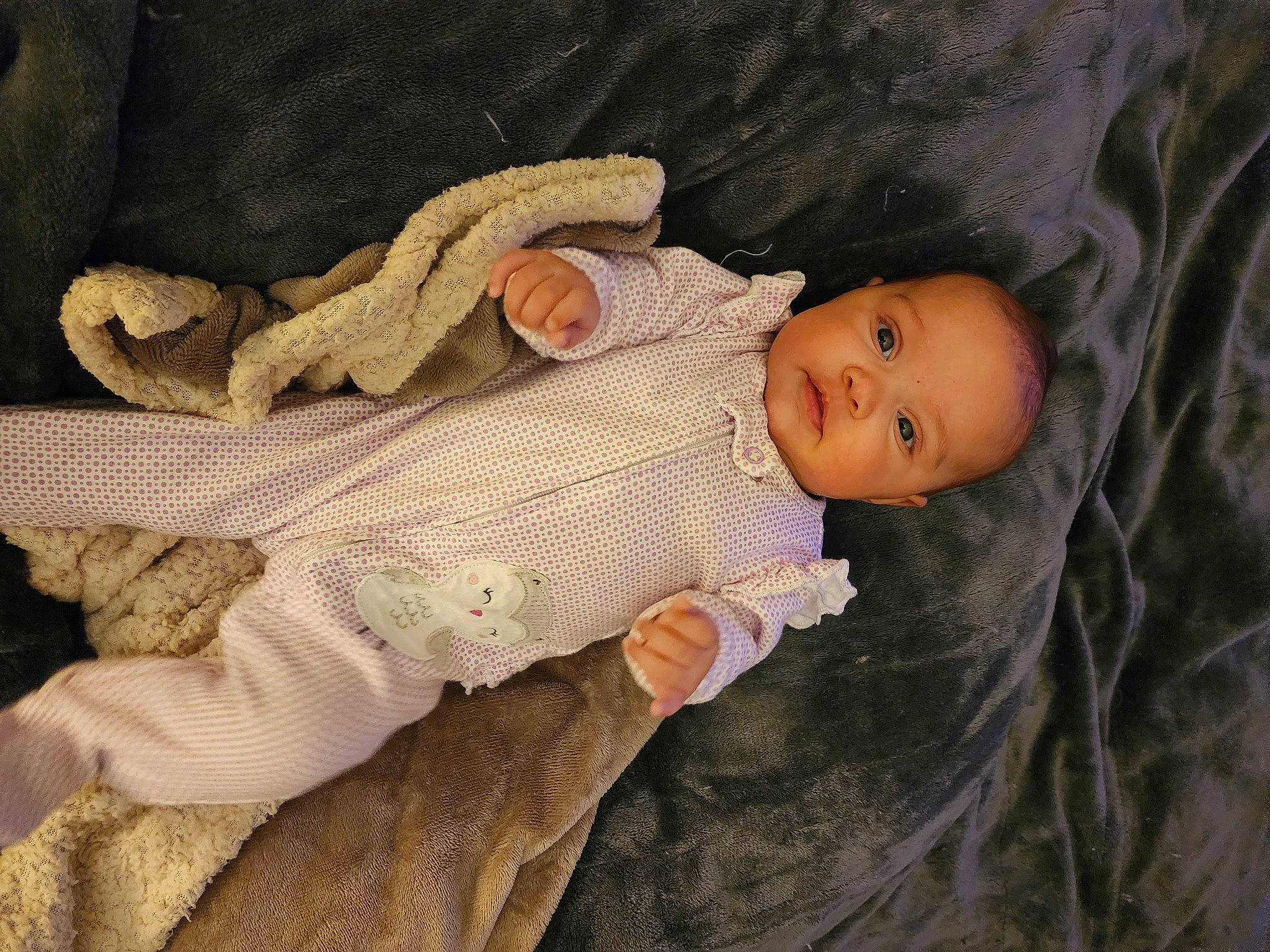 Elizabeth is registered to the contest to win money with this photo: baby, baby_products, baby_sleeping, baby_toddler_clothing, cheek, child, comfort, eye, face, head, human_body, iris, linens, nose, person, skin, sleeve, textile, toddler, wood