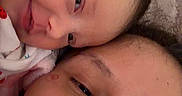 Amethyst is registered to the contest to win money with this photo: adult, affection, baby, child, close_up, cuddle, expression, eyes, face, family, head, human, indoor, infant, love, mouth, nose, portrait, skin, soft_texture