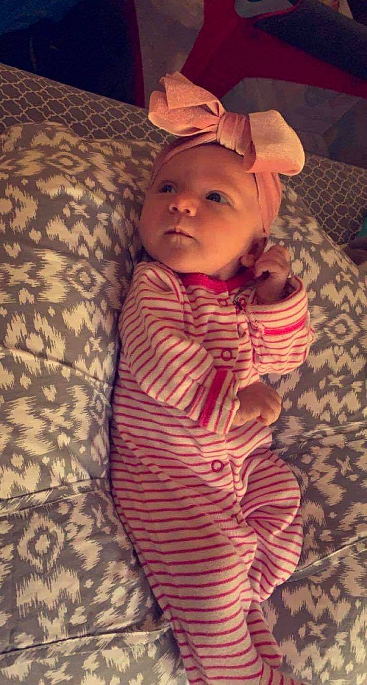 Rilynn joined the competition — help win amazing prizes! baby, baby_toddler_clothing, cheek, child, comfort, eye, face, flooring, human_body, iris, linens, lip, nose, pattern, person, sitting, skin, sleeve, thumb, toddler