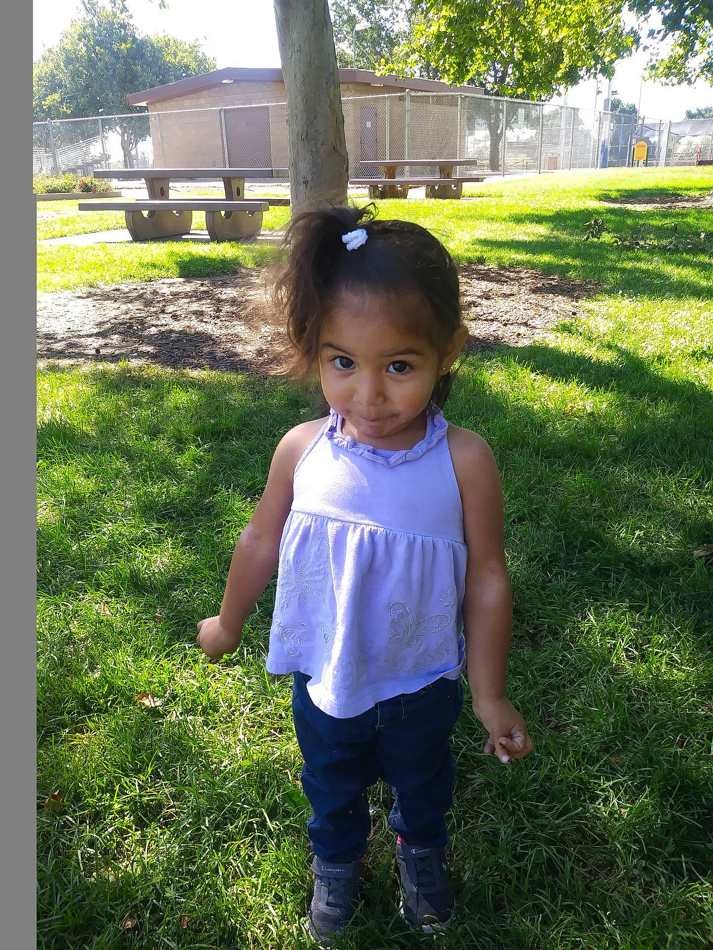 Rosita is registered to the contest to win money with this photo: child, day, fun, garden, girl, grass, happiness, lawn, pattern, person, plant, play, recreation, smile, standing, summer, toddler, tree, trunk, vacation