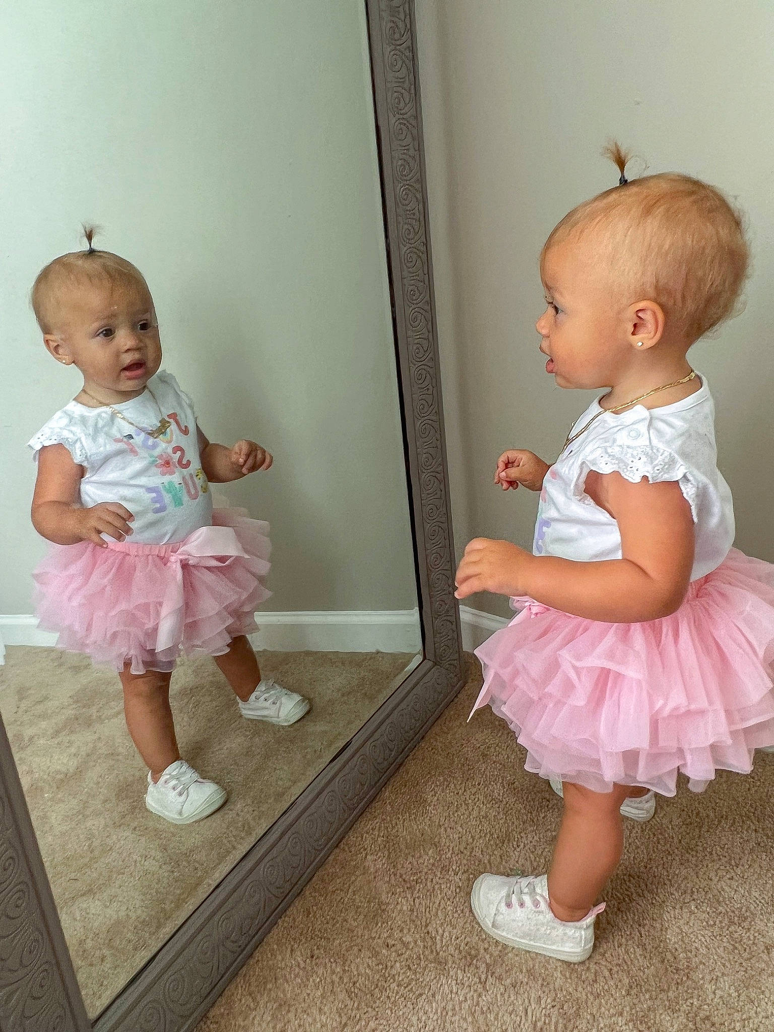 Ariah is registered to the contest to win money with this photo: baby_toddler_clothing, cheek, child, day_dress, embellishment, joint, magenta, one_piece_garment, peach, person, pink, product, room, ruffle, sitting, skin, sleeve, sock, textile, toddler