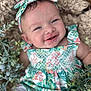 Evelyn joined the competition — help win amazing prizes! baby, smiling, headband, floral_dress, blanket, greenery, leaves, portrait, infant, cute, happy, child, closeup, outdoor, nature, baby_girl, soft_texture, colorful, person, lying_down