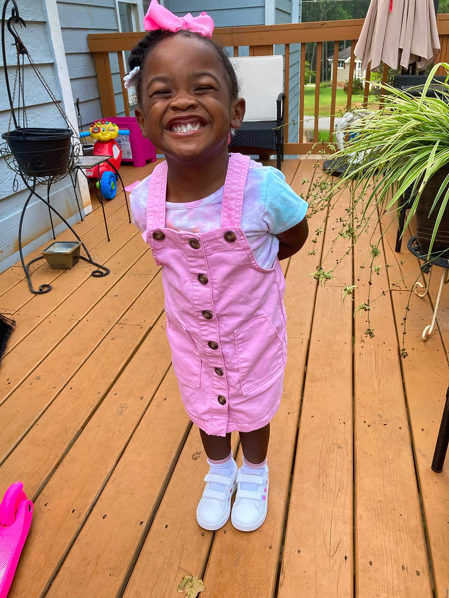 Nia is registered to the contest to win money with this photo: baby_toddler_clothing, beauty, child, flooring, fun, grass, happy, hardwood, hat, joy, leisure, magenta, person, pink, plant, purple, smile, summer, toddler, white