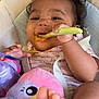 baby, child, feeding, spoon, messy_face, highchair, toy, plush_toy, foot, happy, smiling, curly_hair, clothing, infant, indoor, seat, colorful, cute, person, young_child