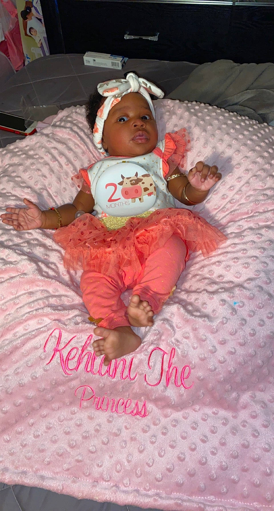 Kehlani is registered to the contest to win money with this photo: baby, baby_products, baby_toddler_clothing, bed, bed_sheet, bedding, bedtime, carmine, cheek, child, comfort, event, head, headwear, lap, linens, person, pink, room, sitting