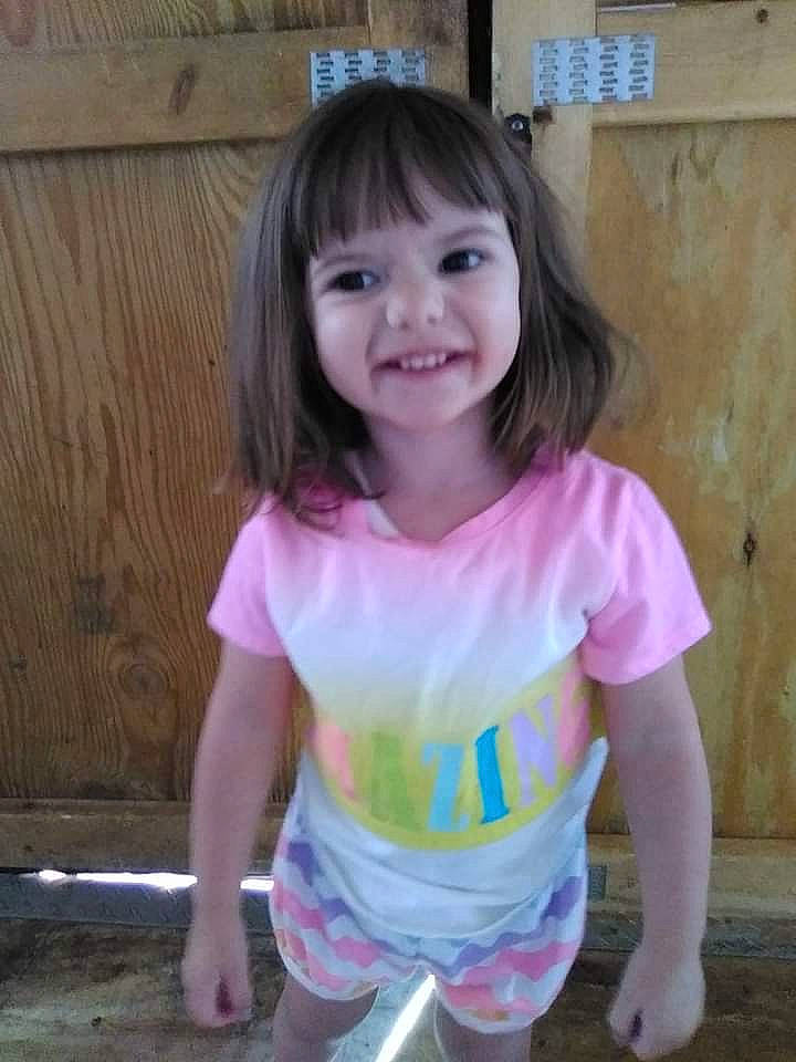 Kynlee is registered to the contest to win money with this photo: baby_toddler_clothing, bangs, child, eyelash, face, fun, hair, happy, head, iris, joy, magenta, pattern, people, person, pink, shorts, sleeve, smile, summer