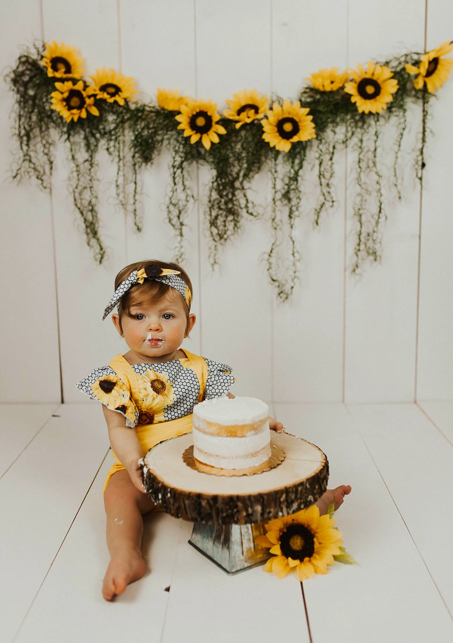 Haylee is registered to the contest to win money with this photo: child, cut_flowers, flower, person, plant, room, sunflower, table, toddler, wildflower, yellow