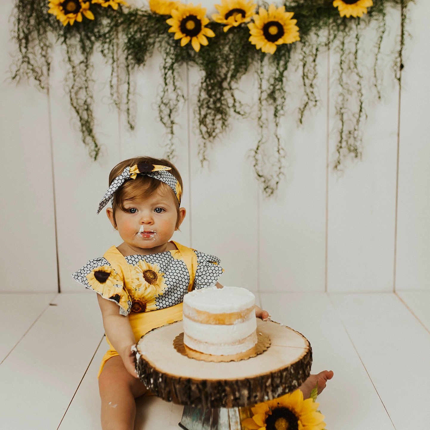 Haylee is registered to the contest to win money with this photo: child, cut_flowers, flower, person, plant, room, sunflower, table, toddler, wildflower, yellow