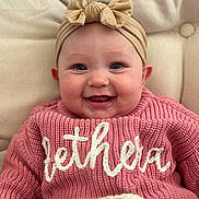 Aethera joined the competition — help win amazing prizes! baby, smiling, headband, bow, pink_sweater, knitwear, cute, infant, portrait, face, happy, child, clothing, cozy, indoor, person, closeup, cuteness, warm, soft_background