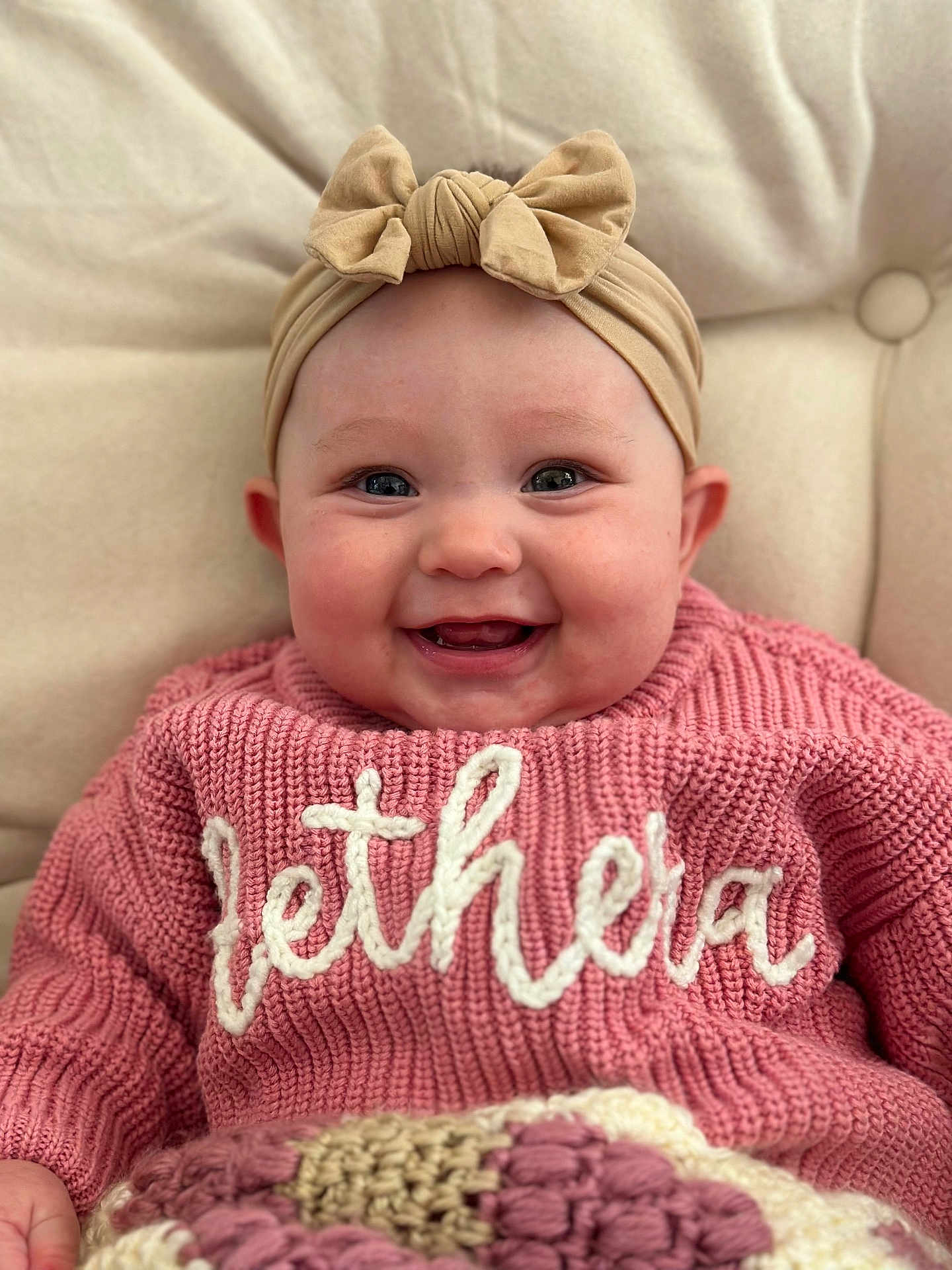 Aethera joined the competition — help win amazing prizes! baby, smiling, headband, bow, pink_sweater, knitwear, cute, infant, portrait, face, happy, child, clothing, cozy, indoor, person, closeup, cuteness, warm, soft_background