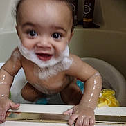 Samson joined the competition — help win amazing prizes! baby, bath, foam, soap, water, child, tub, skin, wet, hands, face, smile, bathroom, cute, playful, bubble_beard, arm, toy, yellow, person
