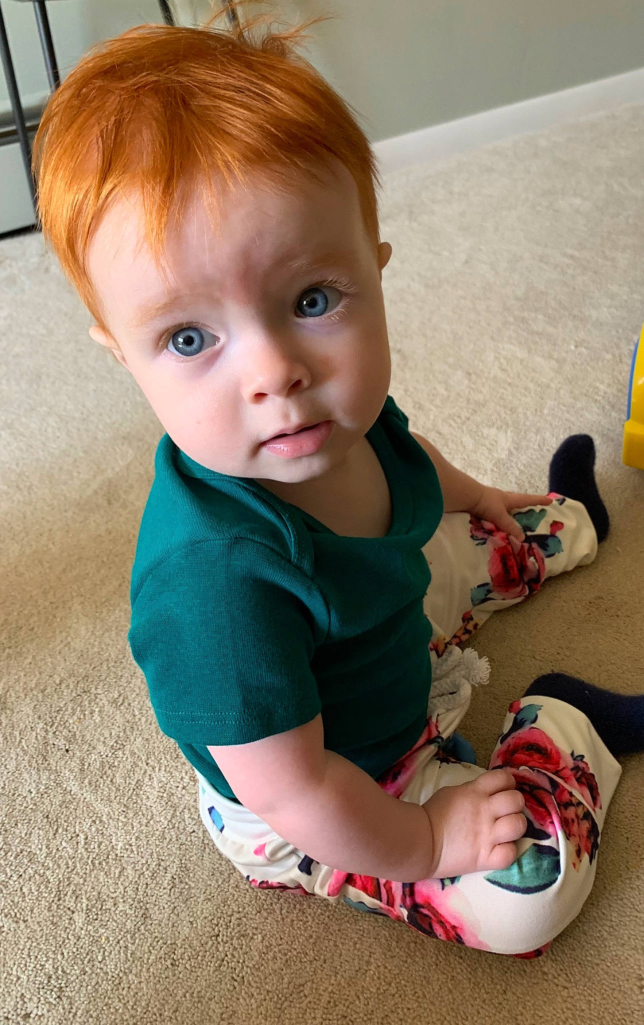 Ada is registered to the contest to win money with this photo: baby, baby_toddler_clothing, cheek, dress, finger, floor, flooring, fun, hair, head, iris, joint, knee, neck, person, shoulder, skin, sleeve, standing, toddler