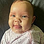 Ember joined the competition — help win amazing prizes! baby, infant, face, tongue, pink_clothing, hearts_pattern, cheeks, smile, eyes, skin, person, cute, child, apparel, portrait, indoors, expression, closeup, baby_girl, soft_light
