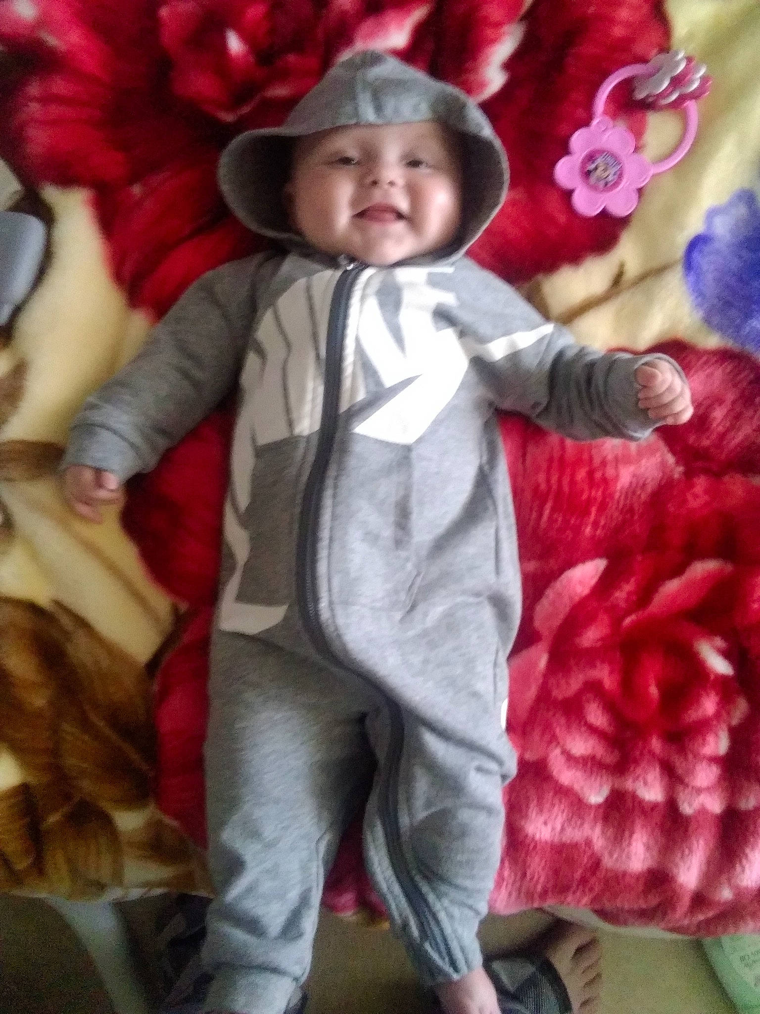 Honest joined the competition — help win amazing prizes! baby, baby_toddler_clothing, child, facial_expression, fun, gesture, hand, happy, headwear, organ, outerwear, person, petal, pink, purple, sleeve, smile, snapshot, standing, sun_hat