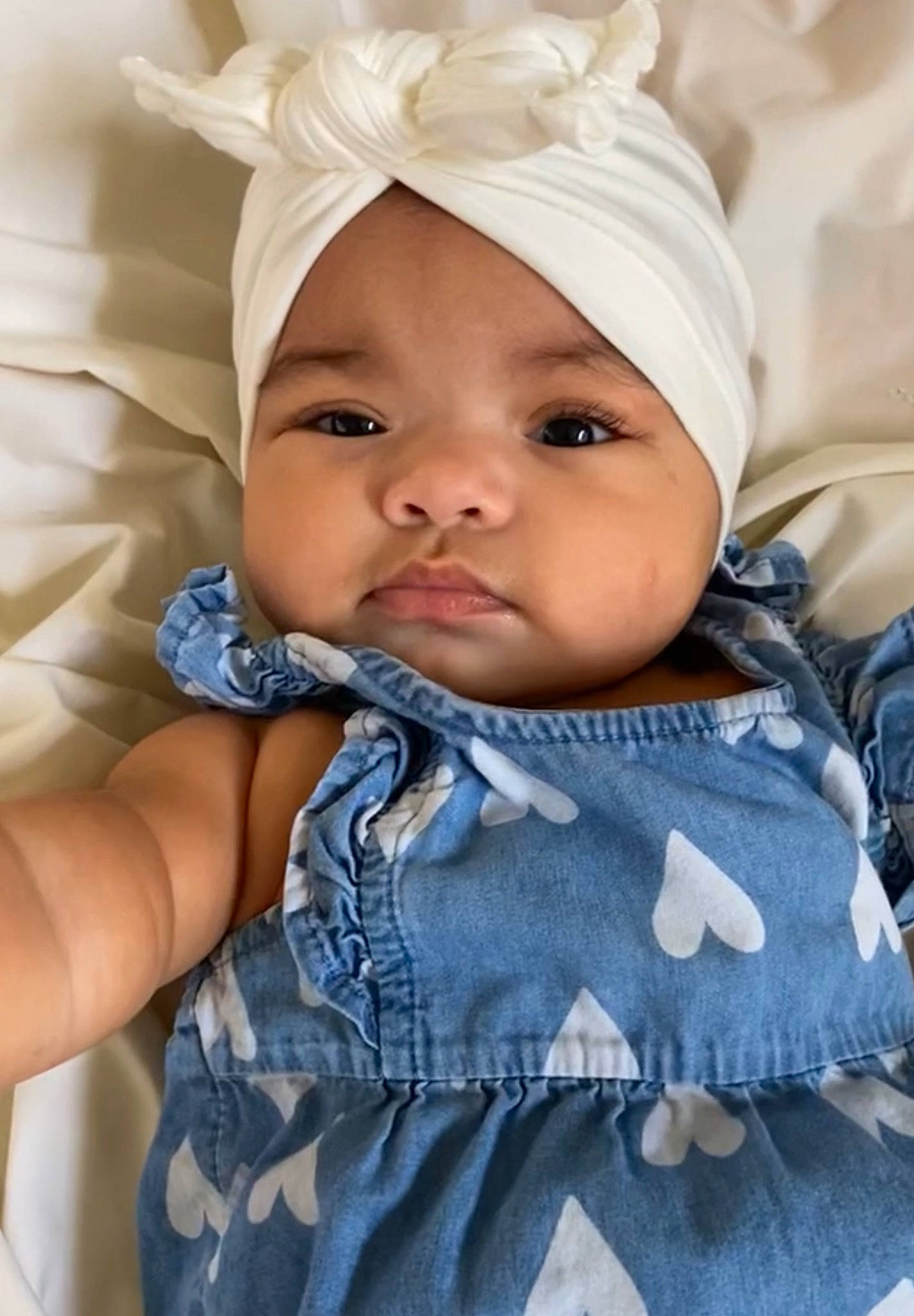 Ariella joined the competition — help win amazing prizes! baby, baby_products, baby_toddler_clothing, cap, child, comfort, electric_blue, eyelash, face, fashion_accessory, happy, headgear, headwear, iris, lip, pattern, person, skin, sleeve, smile