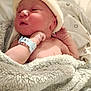 newborn, baby, blanket, hat, hospital_bracelet, sleepy, infant, skin, hand, face, bed, soft, knit, cozy, wrapped, person, portrait, indoors, cute, resting