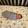 baby, swaddled, crib, blanket, sleeping, winnie_the_pooh, tigger, piglet, bed, sheet, pattern, gray, white, anchor, infant, child, cute, nursery, resting, soft