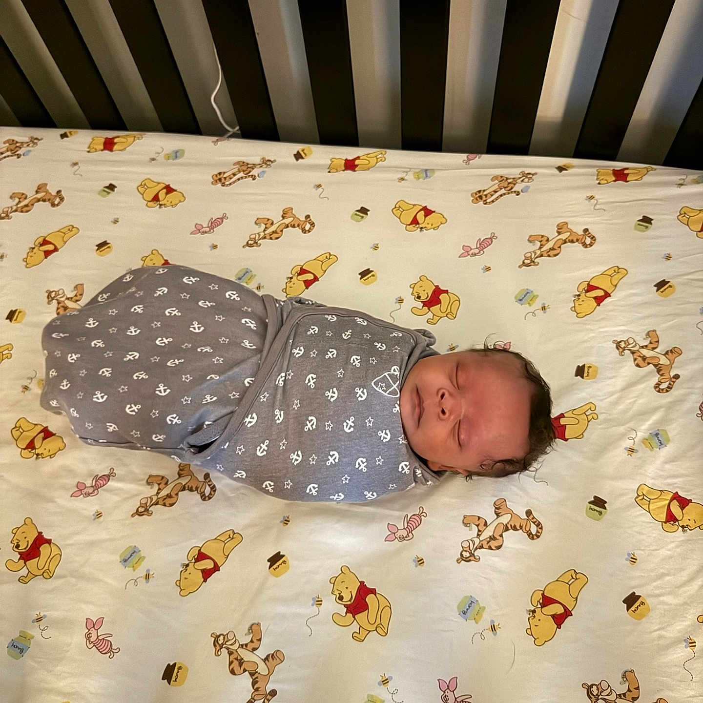 Le'Tavion is registered to the contest to win money with this photo: anchor, baby, bed, blanket, child, crib, cute, gray, infant, nursery, pattern, piglet, resting, sheet, sleeping, soft, swaddled, tigger, white, winnie_the_pooh