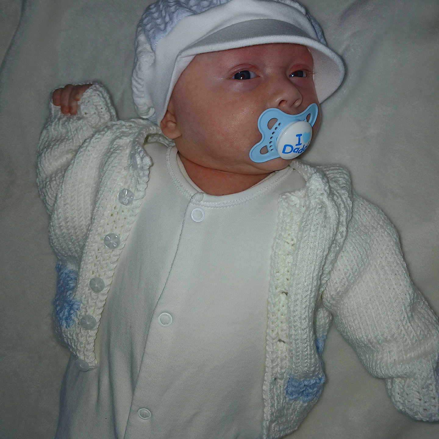 Reggie-James joined the competition — help win amazing prizes! baby, beanie, bed, bonnet, cap, clothing, face, furniture, hat, head, hoodie, knitwear, longsleeve, newborn, person, photography, portrait, sleeve, sweater, sweatshirt